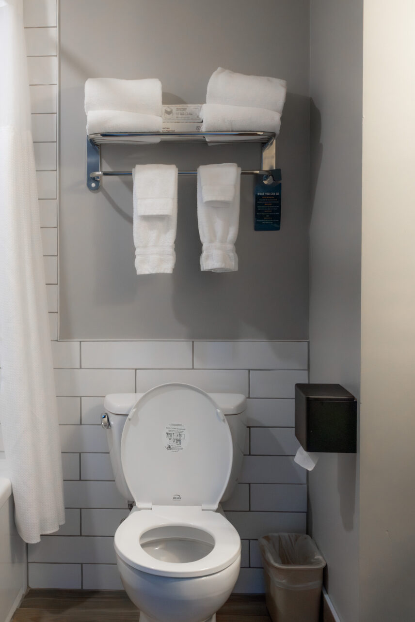 Clean, neat, hotel bathroom with extra towels