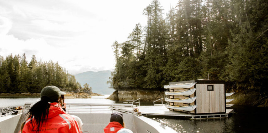 Guests arriving by boat at the remote kayak dock near Tofino