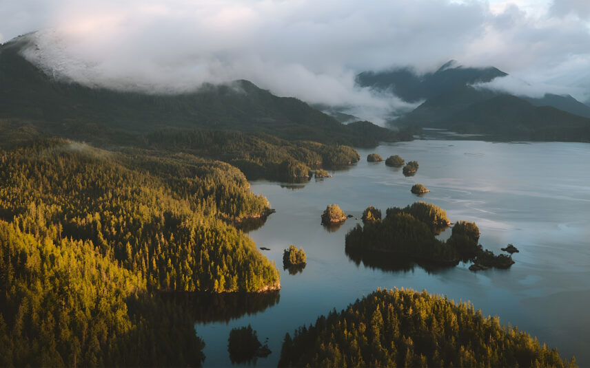 Aerial view of Tofino’s inlet with mist and clouds rolling over the mountains and ocean