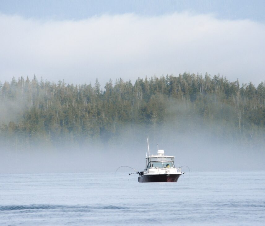 Fishing boat on the misty and foggy ocean