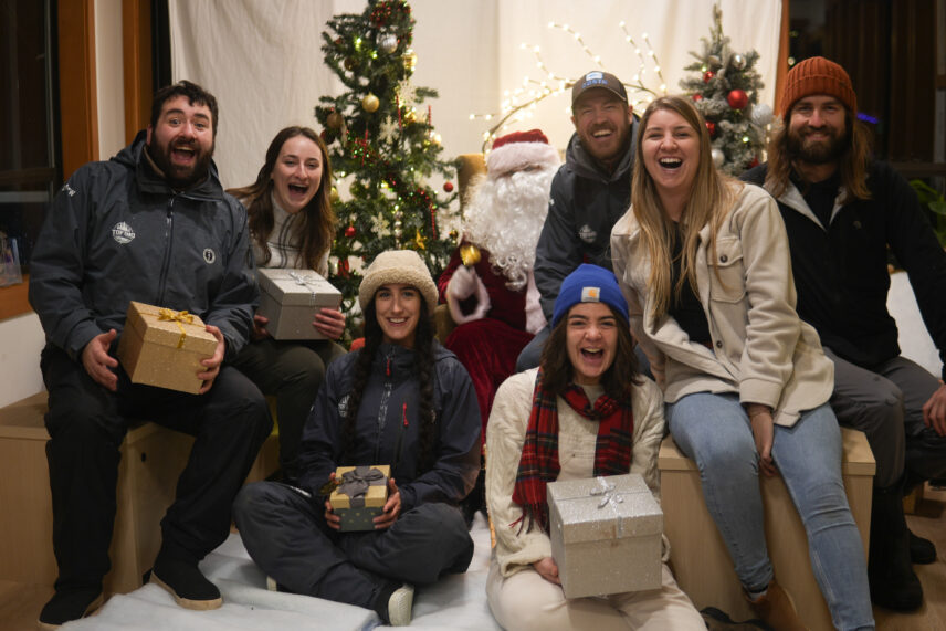 Our team taking photos with Santa Claus