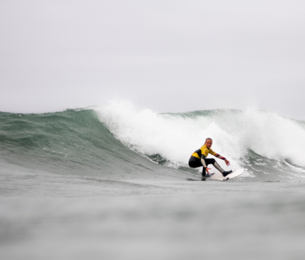 Woman surfing in Tofino