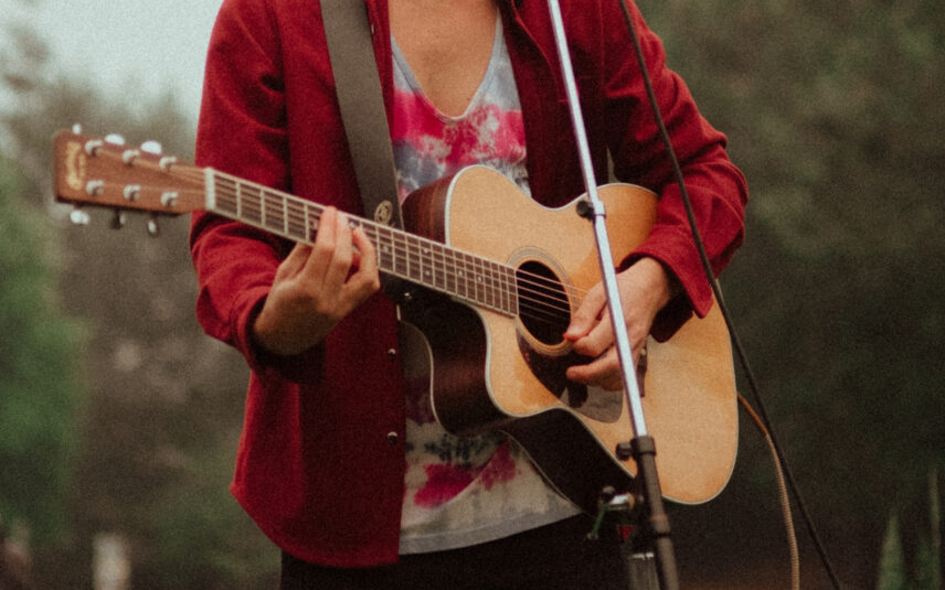 close up of musician playing the guitar